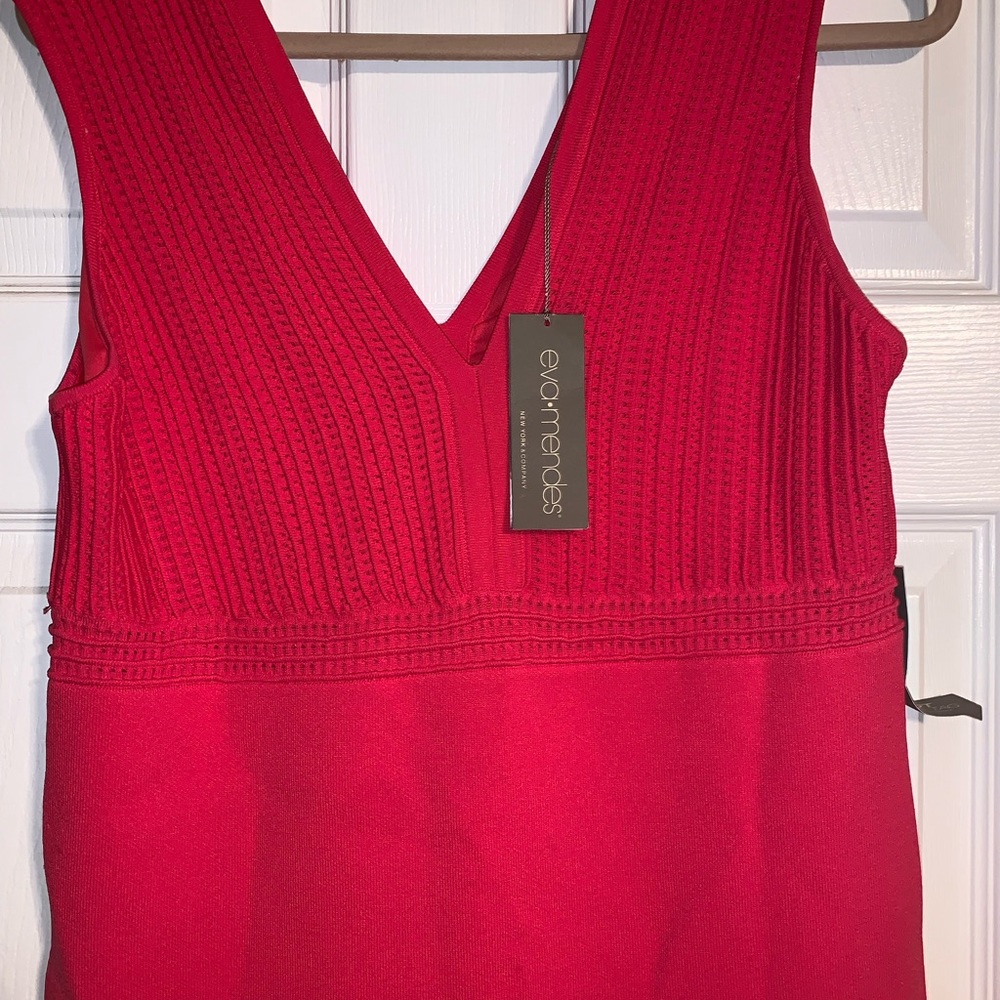 Coral color fitted dress.